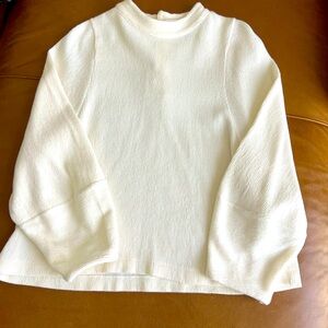Madewell Texture and Thread Medium White Button back mock neck top.